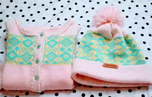 This is a girl fair isle cardigan with a matching hat.  Made to fit a child 3-5 years of age.  It comes with a matching hat.  