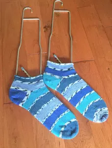 I enjoy knitting socks ever since I first bought my single bed knitting machine.  It was fun making socks but I don't like having side seams.  Until I bought...