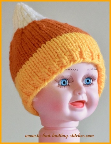 Chunky candy corn hat is a A fast and fun to knit baby hat that looks like a candy corn using chunky yarns.  You can knit this hat in a few hours.