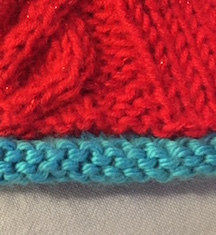 A hat knitted with rolled edge