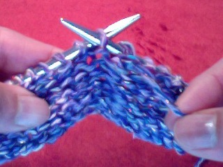 yarn over purl insert needle