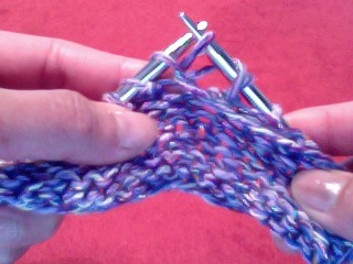 yarn over purl bring yarn through loop